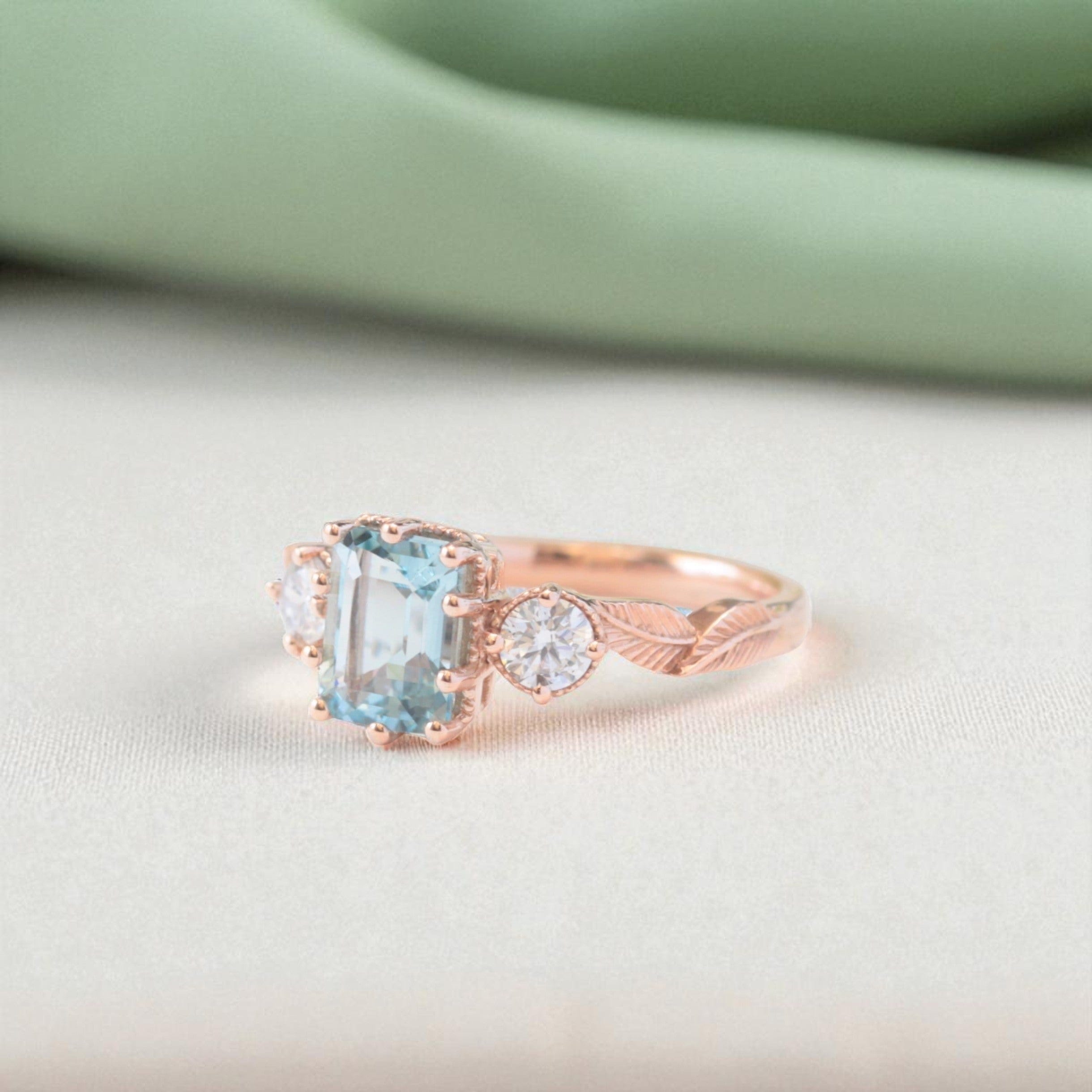 emerald-cut-aquamarine-diamond-leaf-ring-rose-gold