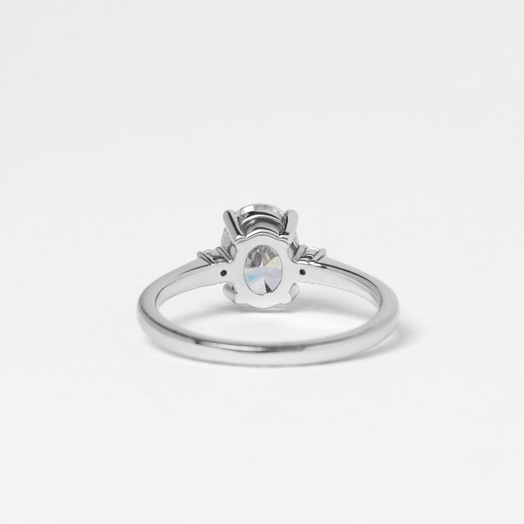 oval moissanite trilogy engagement ring white gold