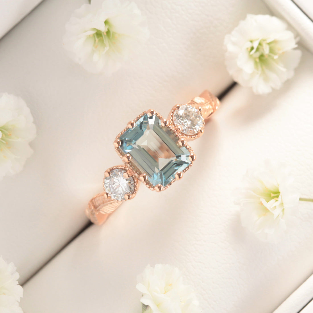 aquamarine and diamond nature engagement ring with leaves