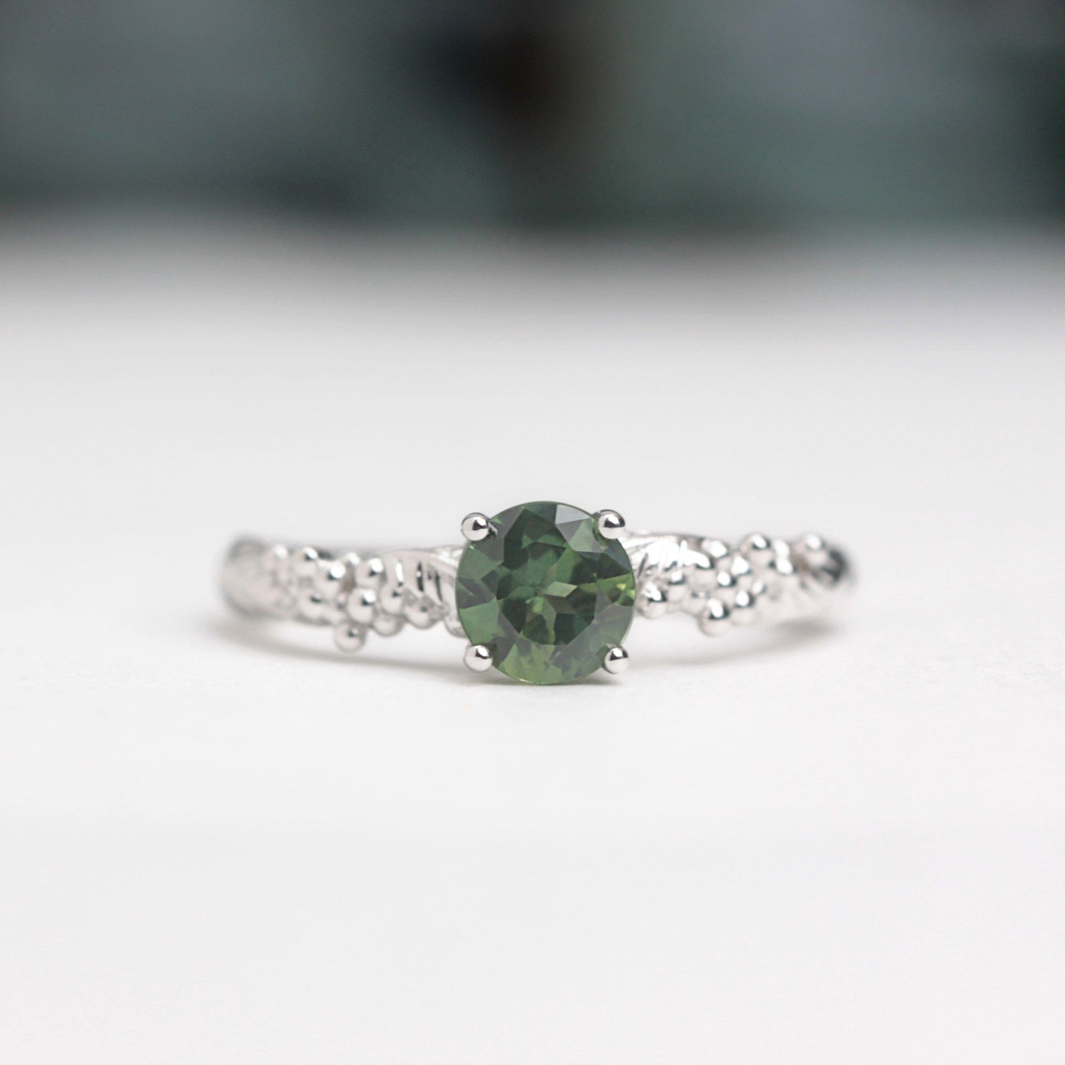 green sapphire wattle leaf engagement ring white gold