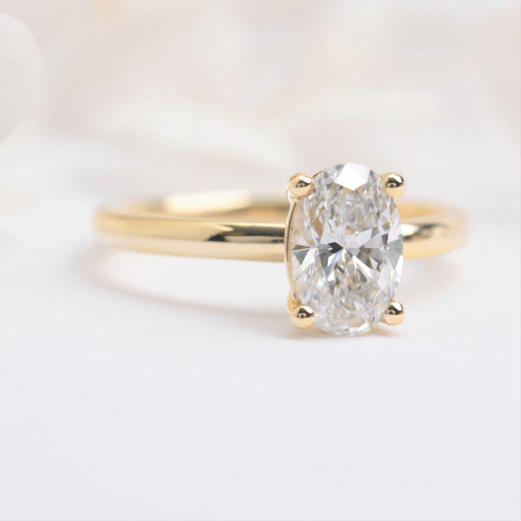 oval solitaire lab diamond engagement ring yellow gold